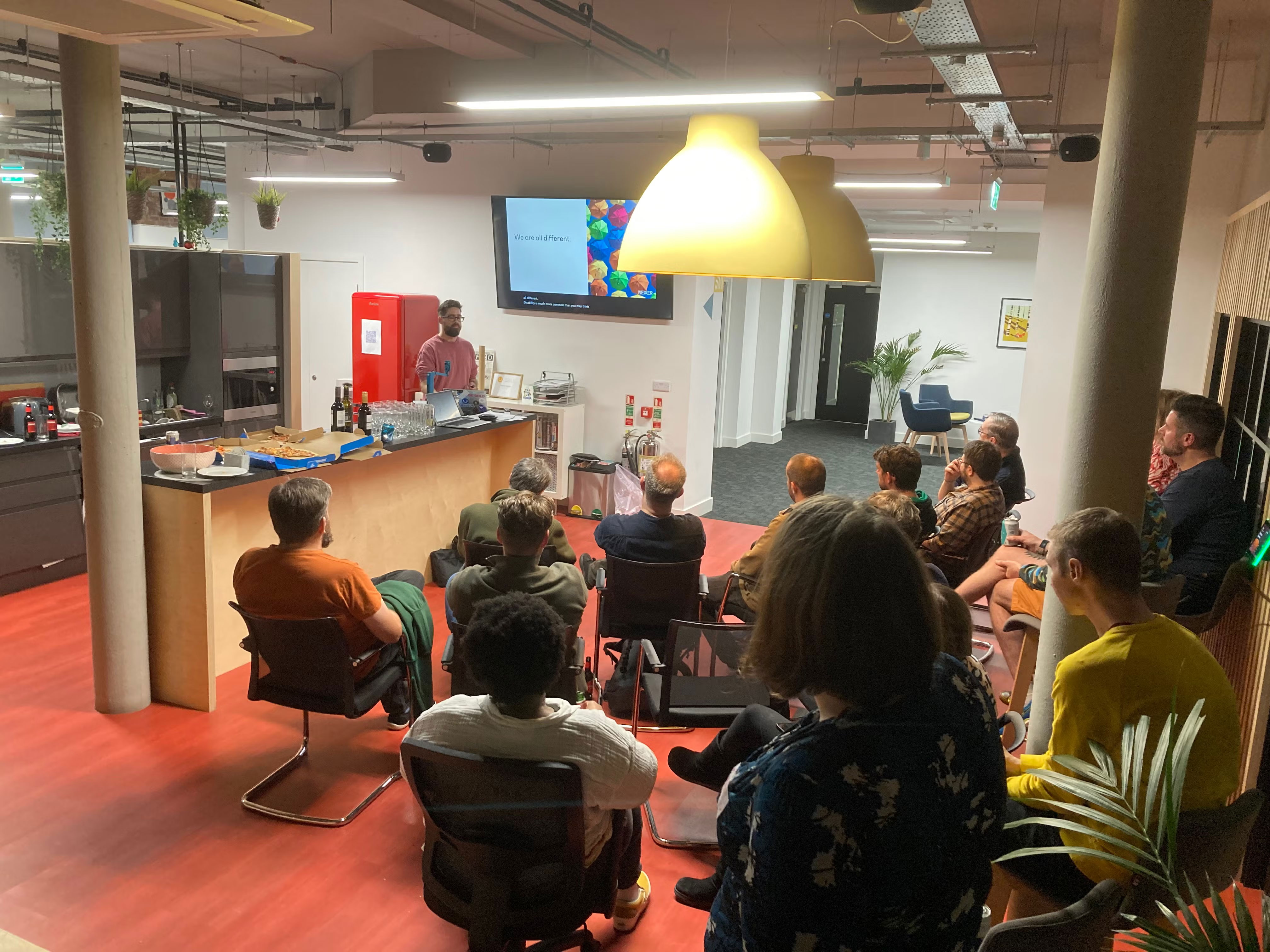 Danny Lancaster presenting to an audience at Macc Tech