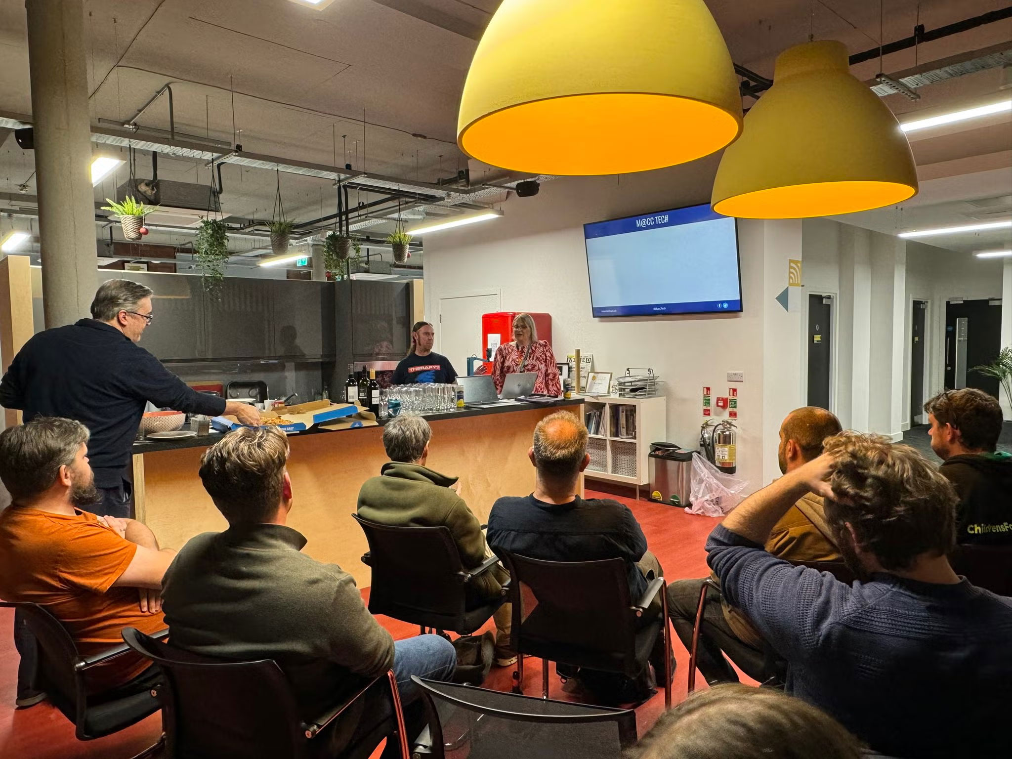 Macc Tech audience stare at a blank screen at the start of a presentation