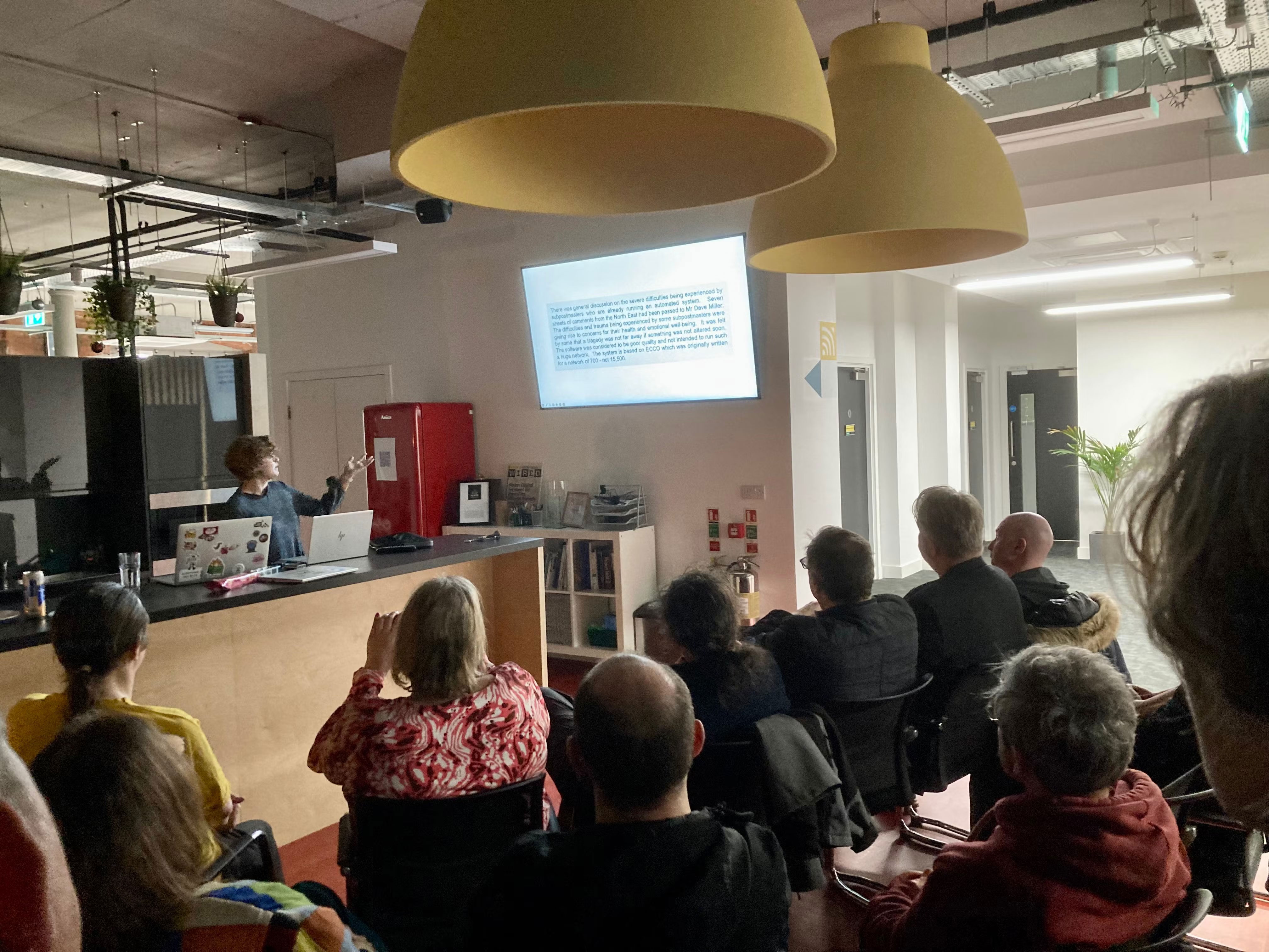 Audience watching Amy present