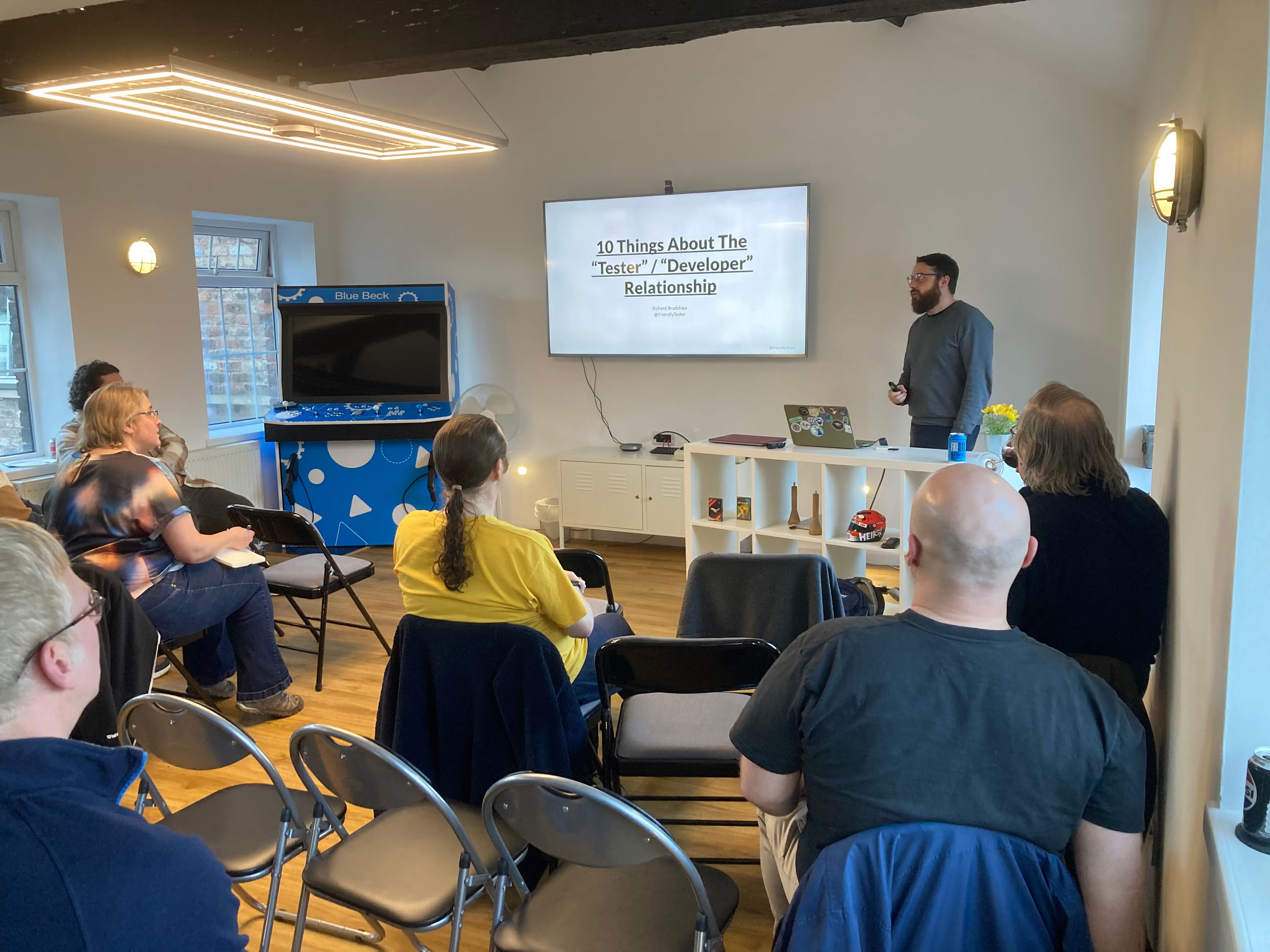 Richard Bradshaw speaking to the audience. Screen reads '10 Things About The Tester / Developer Relationship'