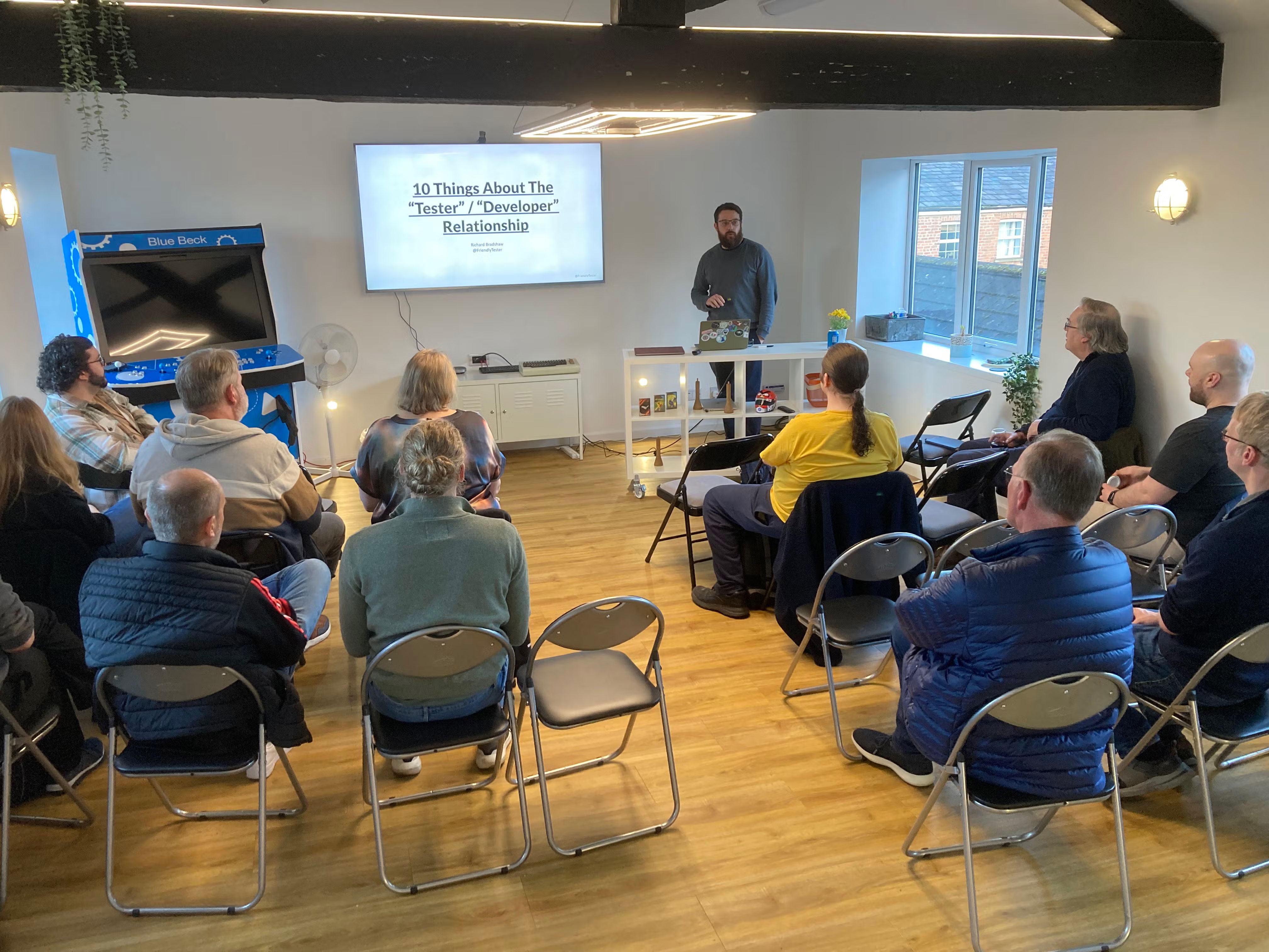Audience watching Richard Bradshaw, photo taken from the back of the room