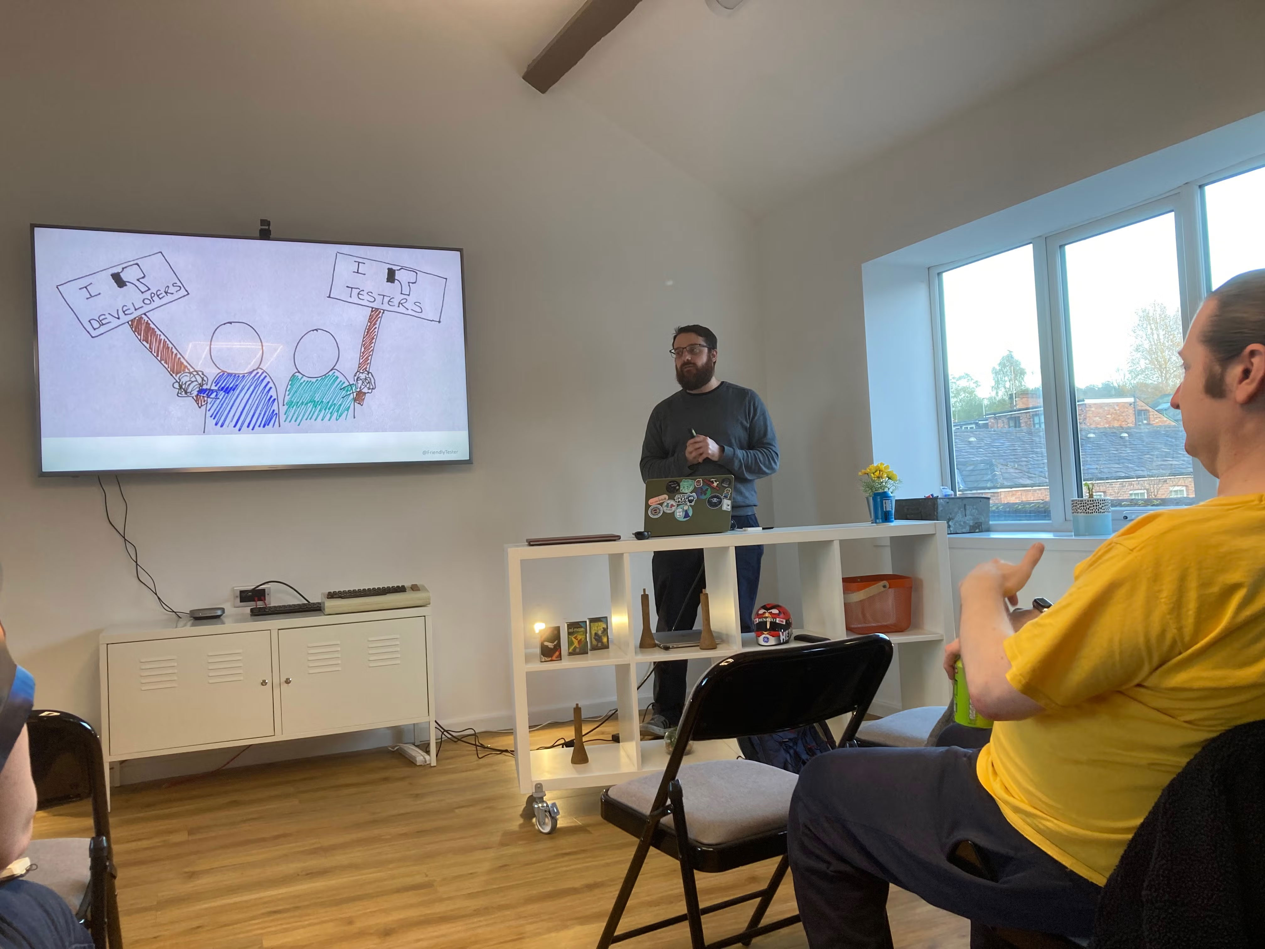 Slide reading 'I 👎Developers / I 👎 Testers'