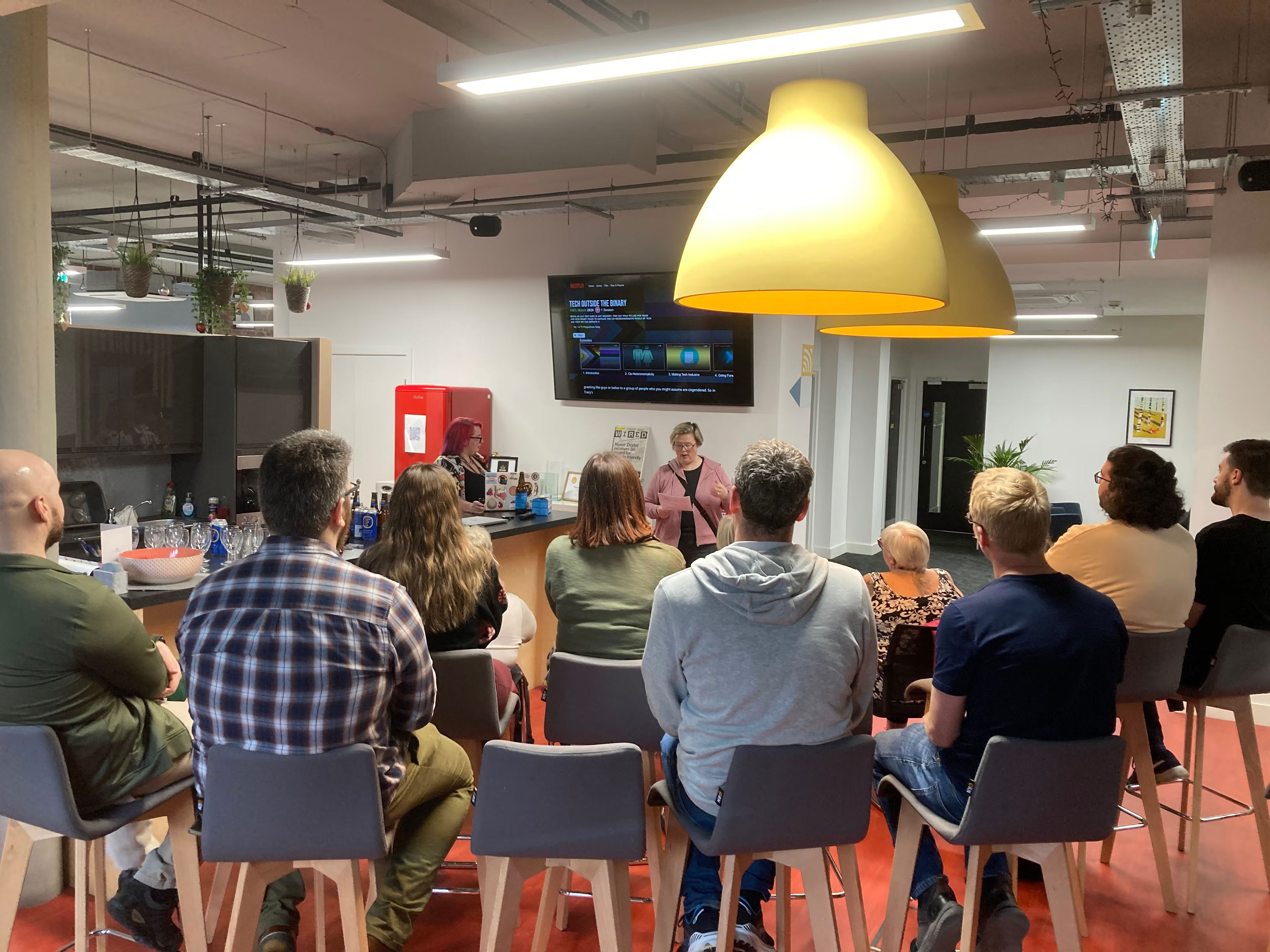 Audience watching Lisa introducing Tracey's talk