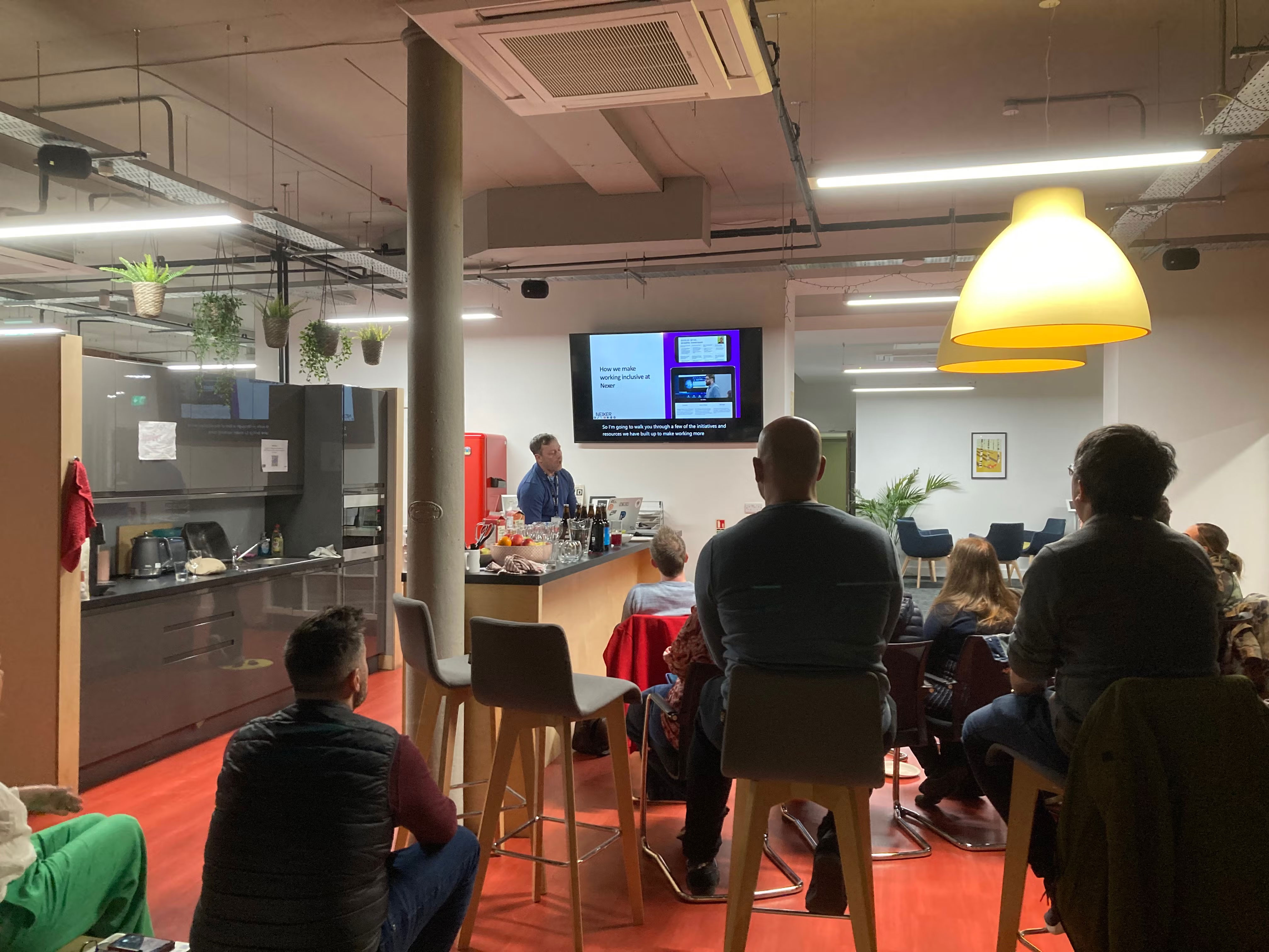 Lee Valentine mid presentation. Audience watching