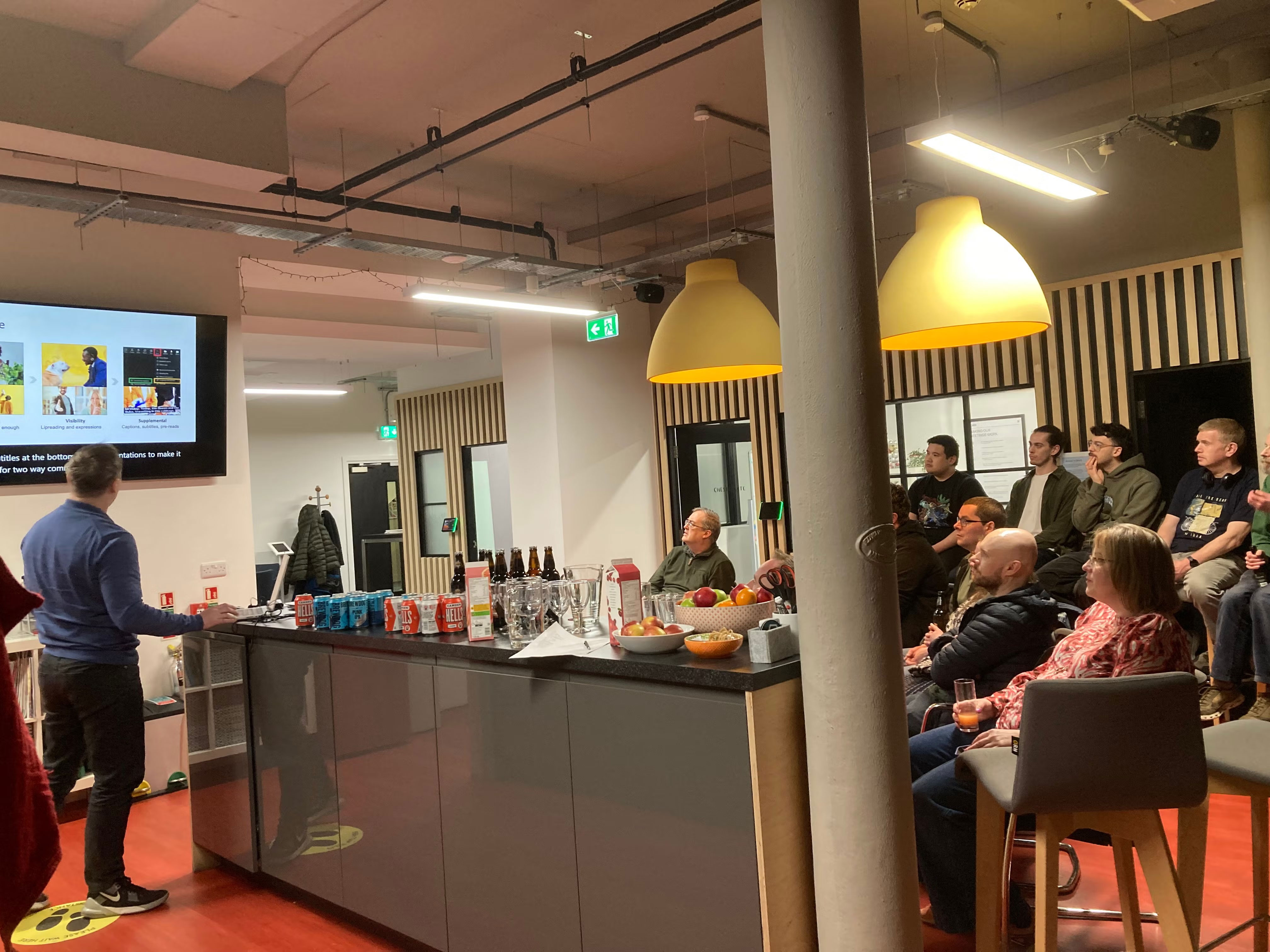 Lee Valentine checks his presentation screen. Audience watching