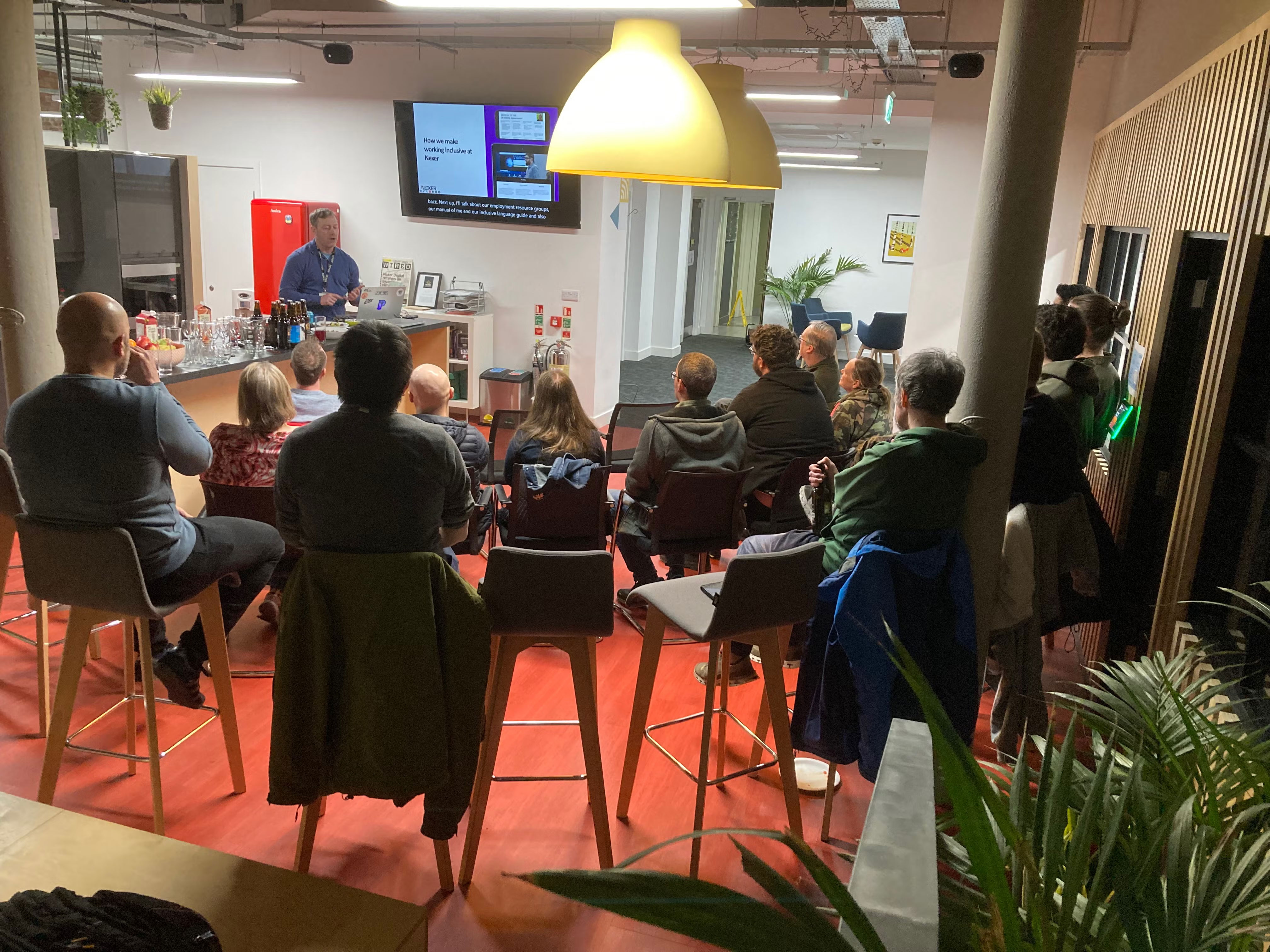 Back of audience view. Lee Valentine presenting.