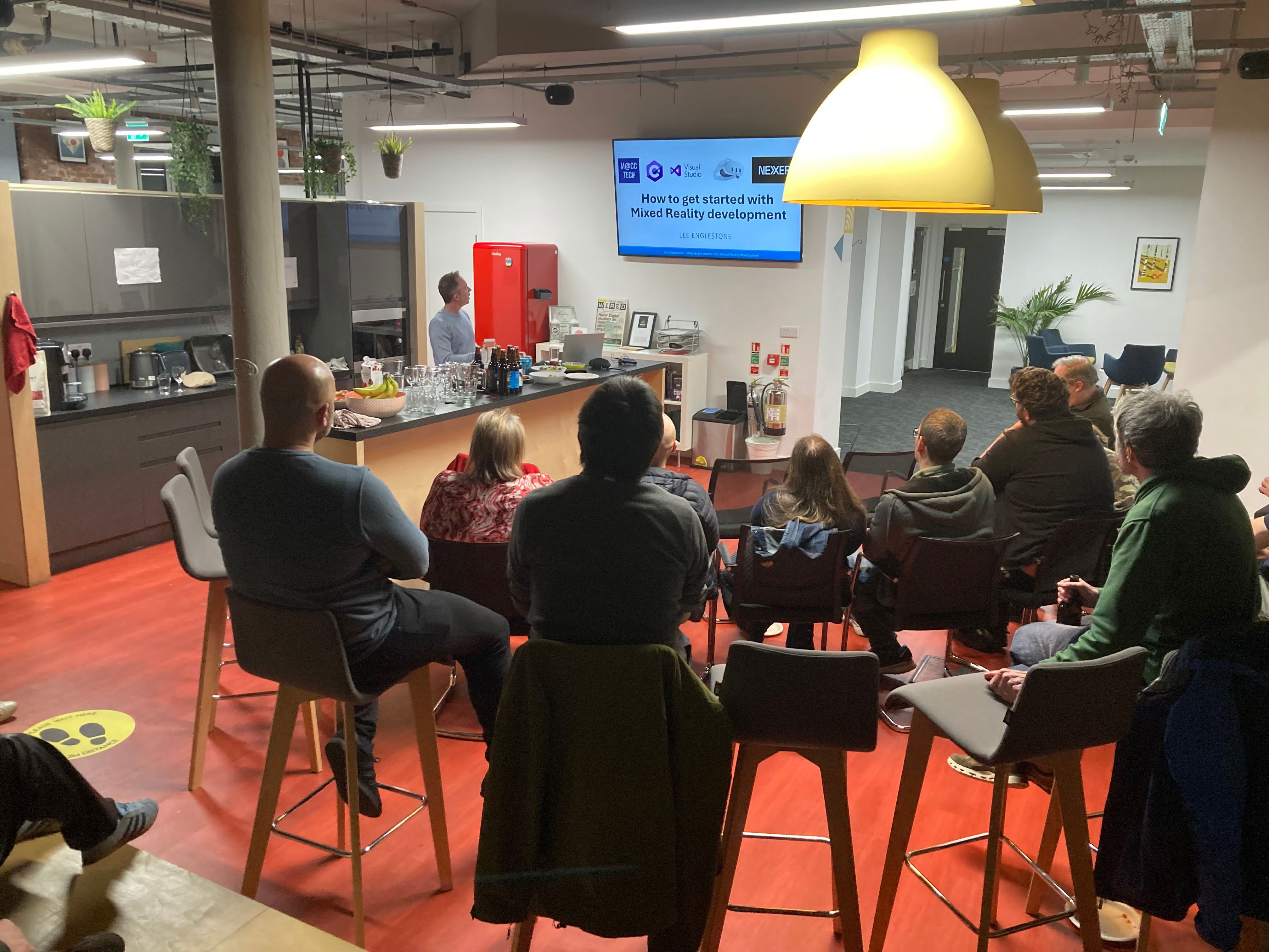 Back of audience view. Lee Englestone presenting.