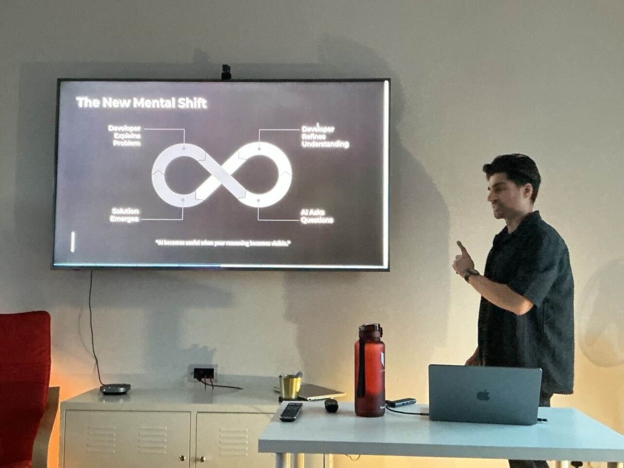 Zahed explains a slide