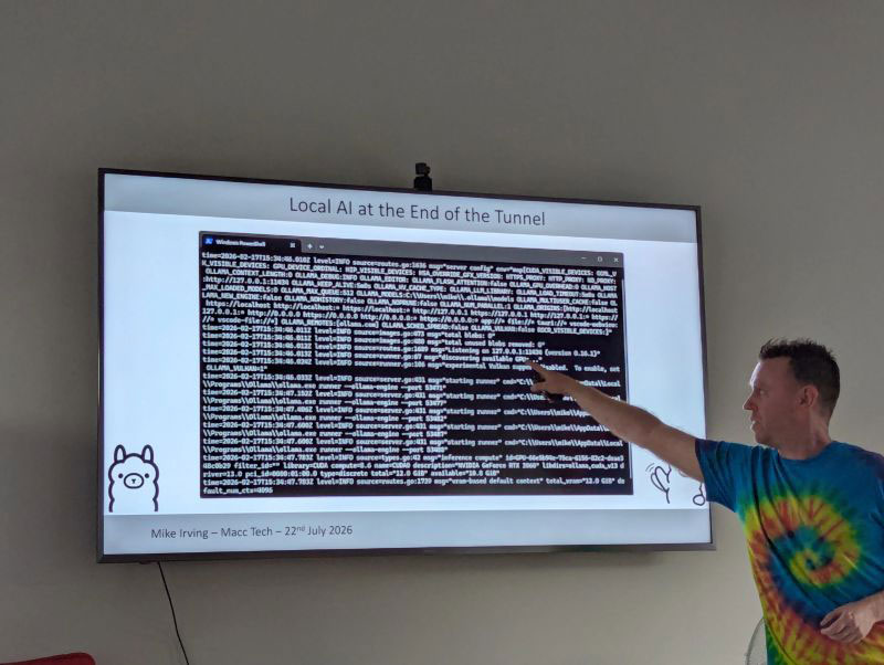 Mike points to a terminal output log on screen